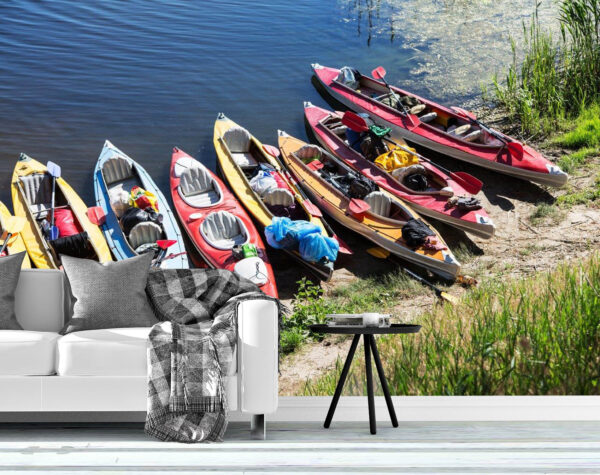 Colorful Canoes On A River Bank Wall Mural