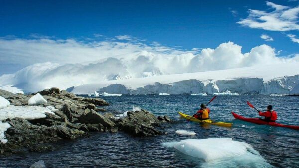 Kayaking Between Antarctic Icebergs Wall Mural